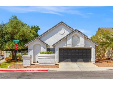 Charming single-story home with a two-car garage, and manicured landscaping in a suburban neighborhood at 2513 Aberdeen Ln, Henderson, NV 89014
