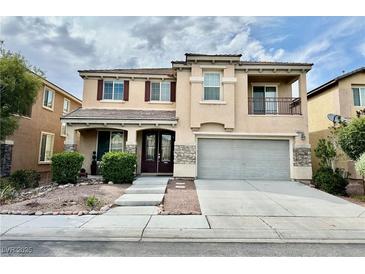 Charming two-story home featuring a covered porch, balcony, and a well-maintained front yard at 3624 Pelican Brief Ln, North Las Vegas, NV 89084