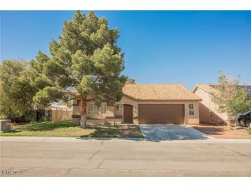 Charming single-story home with a well-maintained front yard and a two-car garage at 4336 Fenton Ln, North Las Vegas, NV 89032