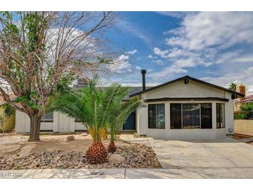 Charming single-story home featuring desert landscaping, fresh exterior paint, and a welcoming entrance at 4387 Sun Vista Dr, Las Vegas, NV 89104