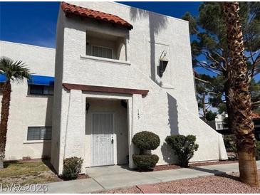 Charming two-story condo with stucco exterior and red tile accent over entrance at 101 Luna Way # 145, Las Vegas, NV 89145