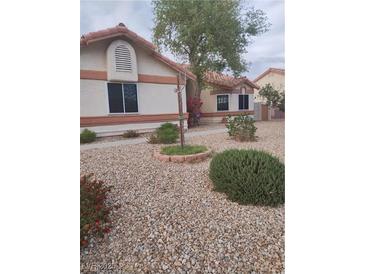 Charming single-story home featuring low maintenance desert landscaping at 7894 W Patrick Ln, Las Vegas, NV 89113