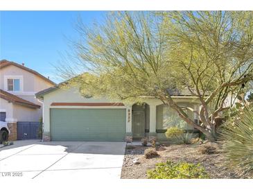 Charming single-story home featuring a well-kept yard and a two-car garage with mature landscaping at 8337 Willow Basin Ct, Las Vegas, NV 89131