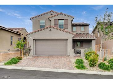 Charming two-story home featuring a neutral color palette, tiled roof, two-car garage, and well-maintained landscaping at 8801 Trotternish Ridge Dr, Las Vegas, NV 89166