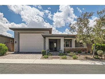 Charming single-story home featuring a two-car garage, covered porch, and well-maintained landscaping at , Henderson, NV 89011