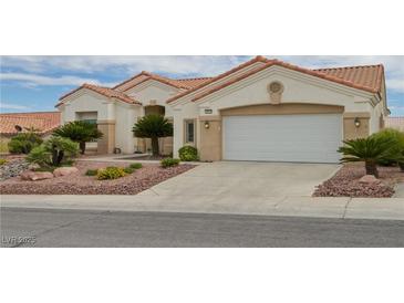 Charming one-story home with a two-car garage and desert landscaping at 10513 Longwood Dr, Las Vegas, NV 89134