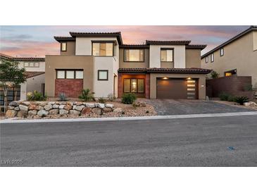 Beautiful two-story home showcasing modern architecture, neutral colors, and a well-manicured front yard at 12155 Sage Thunder Ave, Las Vegas, NV 89138