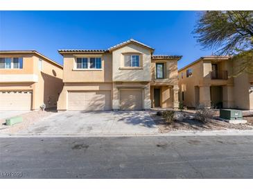 Charming two-story home featuring a three-car garage and desert landscaping at 3774 Dusky Flycatcher St, Las Vegas, NV 89122