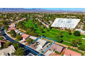 Golf course community home featuring a lush greenway, mature trees, and xeriscaped landscaping in a desirable location at 5000 Linkside Dr, Las Vegas, NV 89130