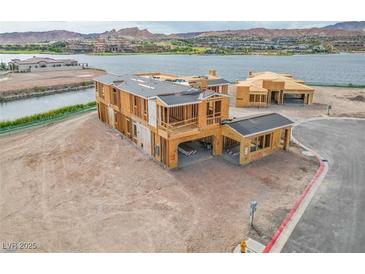 Stunning new construction home with lake views and modern design elements at 65 Bellissima Lago Ct, Henderson, NV 89011