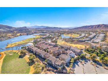 Breathtaking aerial view of lakeside homes and golf course, with mountains in the backdrop at 1 Corte Belleza, Henderson, NV 89011