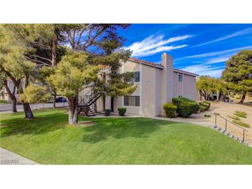 Inviting apartment complex with lush lawn and mature trees offering ground level and upper level units at 1316 Capri Dr # Abc&D, Boulder City, NV 89005