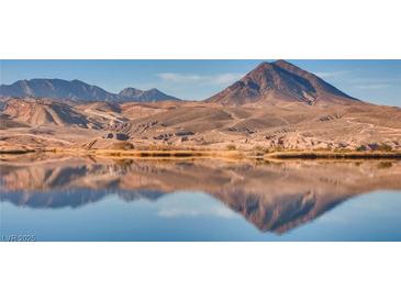Scenic lake view with mountain background, reflecting the sky and landscape in the calm water at 15 Via Mantova # 401, Henderson, NV 89011