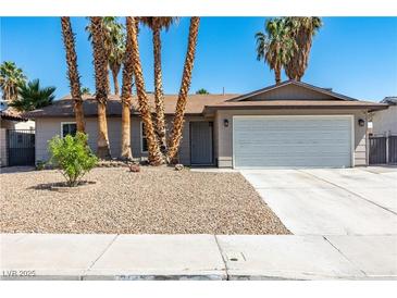 Charming single-story home with a two-car garage and desert landscaping at 3143 La Mesa Dr, Henderson, NV 89014