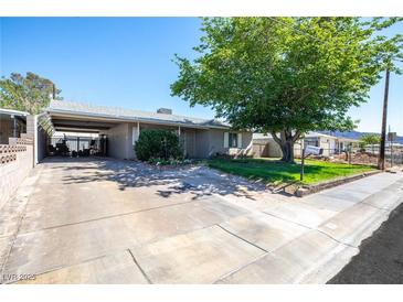 Quaint single story home with a carport and mature shade tree at 7 Sturm St, Henderson, NV 89015