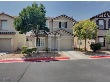 Two-story home featuring manicured landscaping and an attached garage at 7257 Early Pioneer Ave, Las Vegas, NV 89129