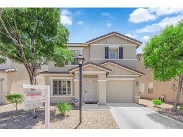 Charming two-story home with a well-manicured lawn and a classic architectural design at 7257 Early Pioneer Ave, Las Vegas, NV 89129