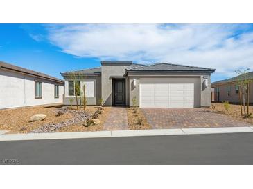 Charming single-story home featuring a 2-car garage, desert landscaping, and a welcoming front entrance at 4410 E Brusca Way, Pahrump, NV 89061