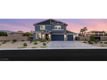 Beautiful two-story home featuring a well-manicured front yard and a two-car garage at 5449 Hickory Tree St, Las Vegas, NV 89149