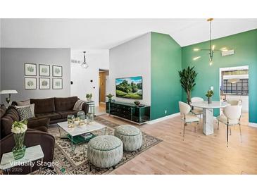 Bright living room with modern decor, stylish furniture, and decorative wall art and fixtures at 1655 E Hacienda Ave, Las Vegas, NV 89119