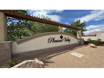 Welcoming entrance to Pleasant Valley neighborhood with shaded pergola and stone accents at 2598 Fountain Ave, Pahrump, NV 89048