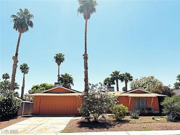 Charming single-story home with desert landscaping and mature palm trees in a sunny setting at 3855 Mayhill Ave, Las Vegas, NV 89121