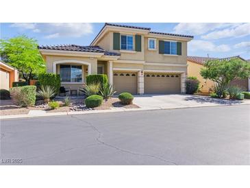 Charming two-story home featuring a landscaped front yard and a two-car garage at 7417 Horizon Rock Ave, Las Vegas, NV 89179