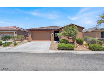 Charming single-story home featuring desert landscaping, tile roof, and inviting curb appeal at 7428 Alamo Ranch Ave, Las Vegas, NV 89179