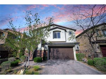 Charming two-story home featuring a two-car garage and well-manicured landscaping at 2332 Mundare Dr, Henderson, NV 89002