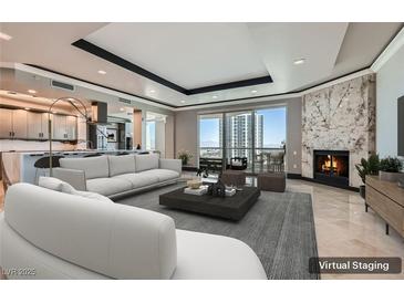 Bright, open living space with floor-to-ceiling windows and a modern fireplace, virtually staged for appeal at 2777 Paradise Rd # 2701, Las Vegas, NV 89109
