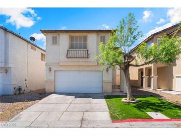 Charming two-story home featuring stucco facade, attached two-car garage and a well-manicured front yard at 4321 Stockbridge St, Las Vegas, NV 89115
