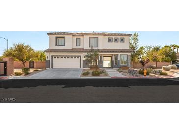 Charming two-story home featuring a well-manicured front yard, desert landscaping, and a two-car garage at 6315 Bellisima St, Las Vegas, NV 89118