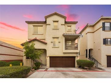 Charming two-story townhome with a well-maintained front yard and attached garage at 6488 Bentley Wood Ct, Las Vegas, NV 89130