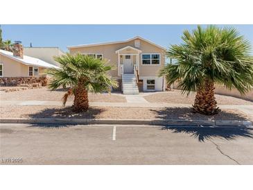 Inviting home featuring well-manicured landscaping and a charming exterior at 663 D Ave, Boulder City, NV 89005