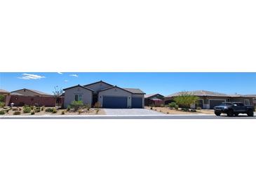 Charming single-story home with a low maintenance front yard at 73 Hawk Ave, Pahrump, NV 89060