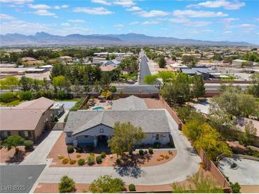 Expansive aerial view of a single-Gathering home showcasing desert landscape and mountain views at 8125 Soledad Canyon St, Las Vegas, NV 89131