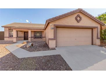 Charming single-story home with desert landscaping, covered porch, and attached two-car garage at 286 Fairmeadow St, Henderson, NV 89012