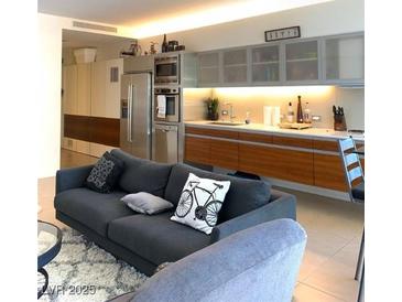 Open floor plan featuring a living room with a modern kitchen and stainless steel appliances at 3722 S Las Vegas Blvd # 1111, Las Vegas, NV 89113