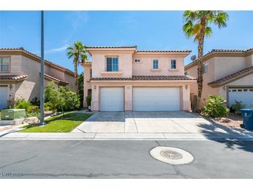 Beautiful two-story home featuring a spacious three-car garage and palm trees at 3766 Port Ritchey St, Las Vegas, NV 89147