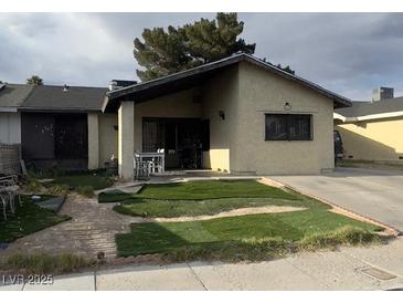 Charming single-story home with an unfinished lawn and a covered front porch perfect for enjoying the outdoors at 4820 Mahogany Dr, Las Vegas, NV 89110