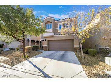 Charming two-story home with a well-maintained front yard and attached two-car garage at 6837 Dragonfly Rock St, Las Vegas, NV 89148