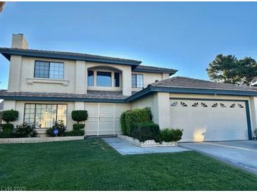 Charming two-story home with manicured lawn and attached two car garage at , Las Vegas, NV 89117