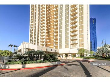 Contemporary high-rise features a valet area and meticulously landscaped grounds with palm trees at 135 E Harmon Ave # 1102, Las Vegas, NV 89109