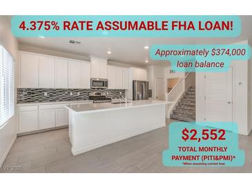 Bright kitchen boasts an island, stainless appliances, and a modern backsplash at 219 Cordelia Cove Ave # 513, Henderson, NV 89011