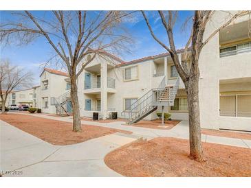 Inviting condo complex featuring multiple units with private balconies and stairs for easy access at 3318 N Decatur Blvd # 1061, Las Vegas, NV 89130