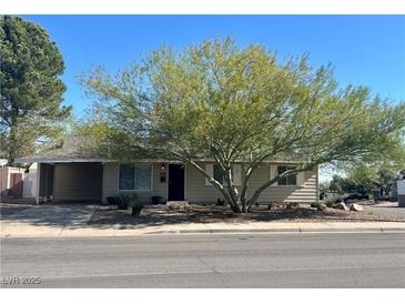 Charming single-story home with a well-maintained front yard and mature tree providing ample shade at 429 Scenic Dr, Henderson, NV 89002