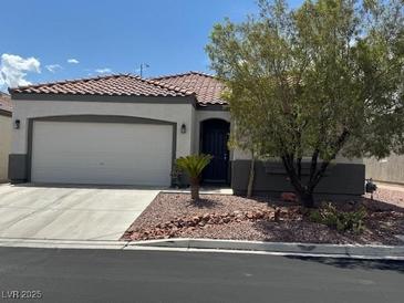 Charming single-story home features a well-maintained front yard and a spacious two-car garage at 8325 Aspen Village St, Las Vegas, NV 89113