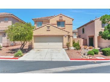 Charming two-story home featuring a two-car garage, well-maintained landscaping, and a welcoming facade at 9324 Freedom Heights Ave, Las Vegas, NV 89149