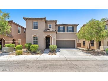 Inviting two-story home with a well-maintained front yard and a two-car garage at 7115 Hickory Post Ave, Las Vegas, NV 89179