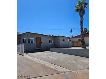 Charming single-story home with modern design elements and desert landscaping at 131 Copper St, Henderson, NV 89015